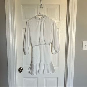White long sleeve Vici dress. High neck with bow tie on the back.